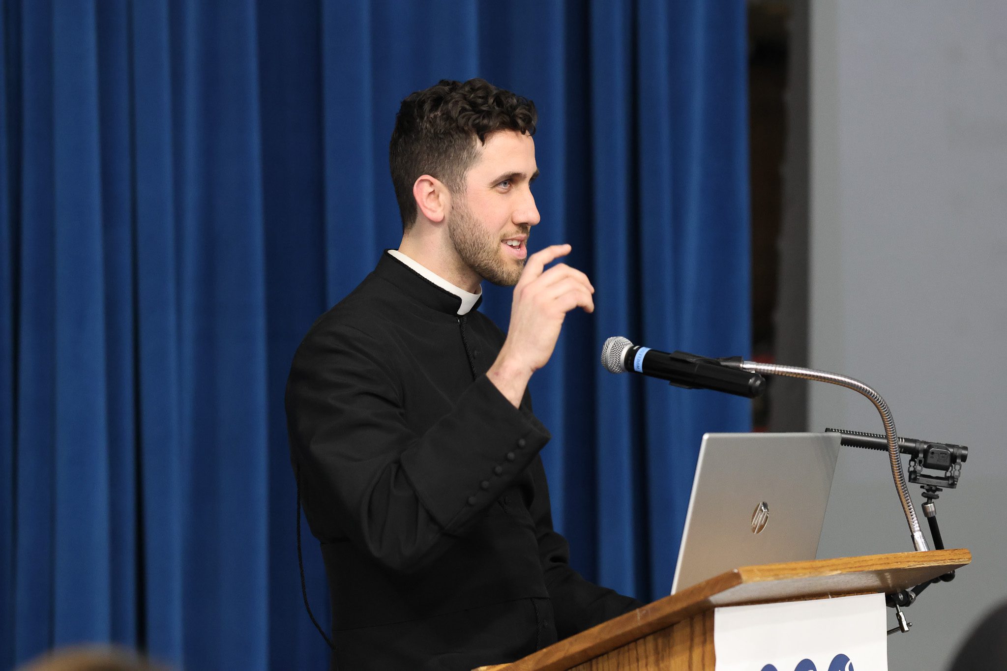Fr. Girardi at the podium during Week 3 of the Lent Talk Series
