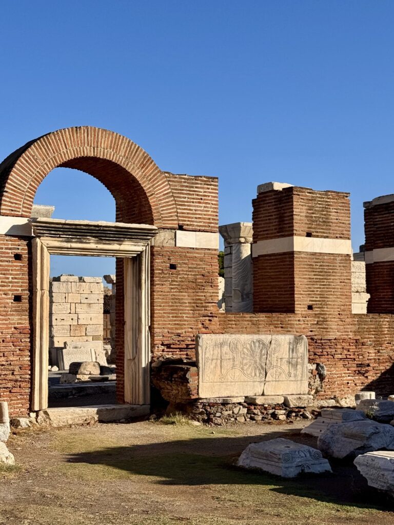 A brick archway and marble doorframe in the basilica ruins
