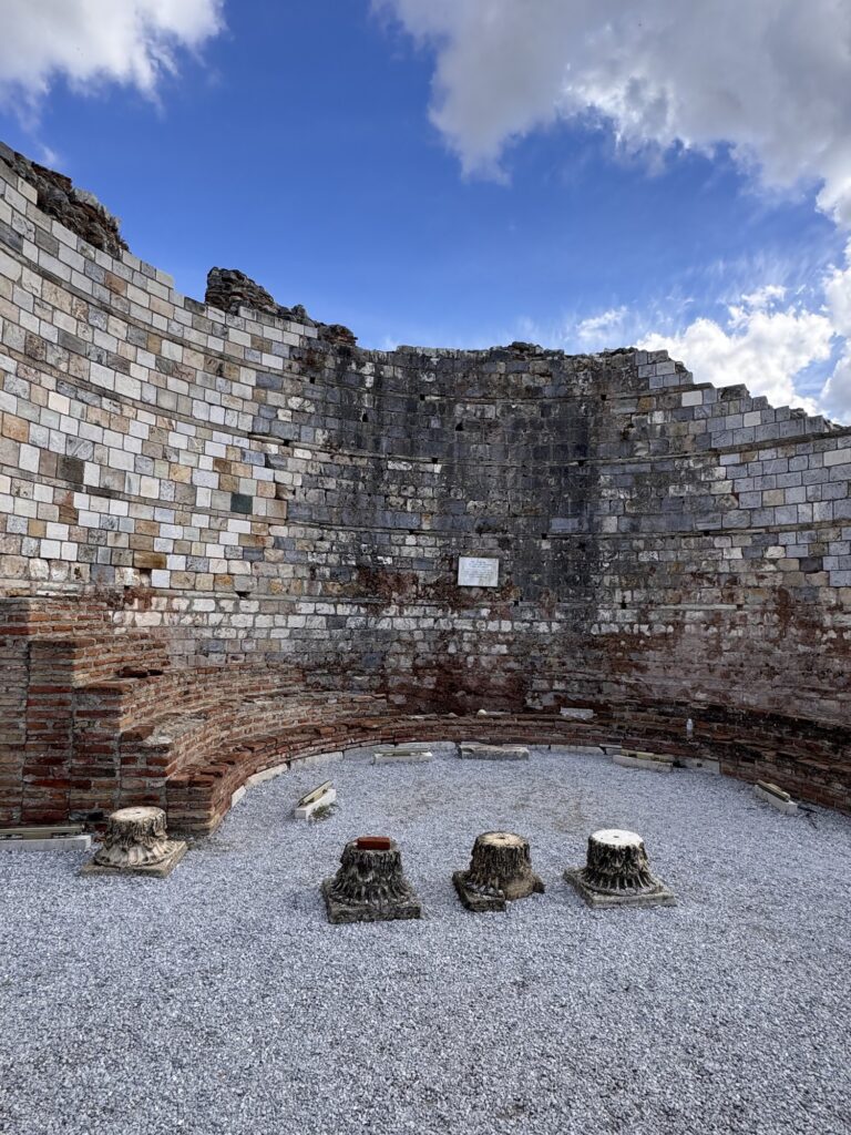 The ruined apse of the Church of Mary with column bases on the gravel floor