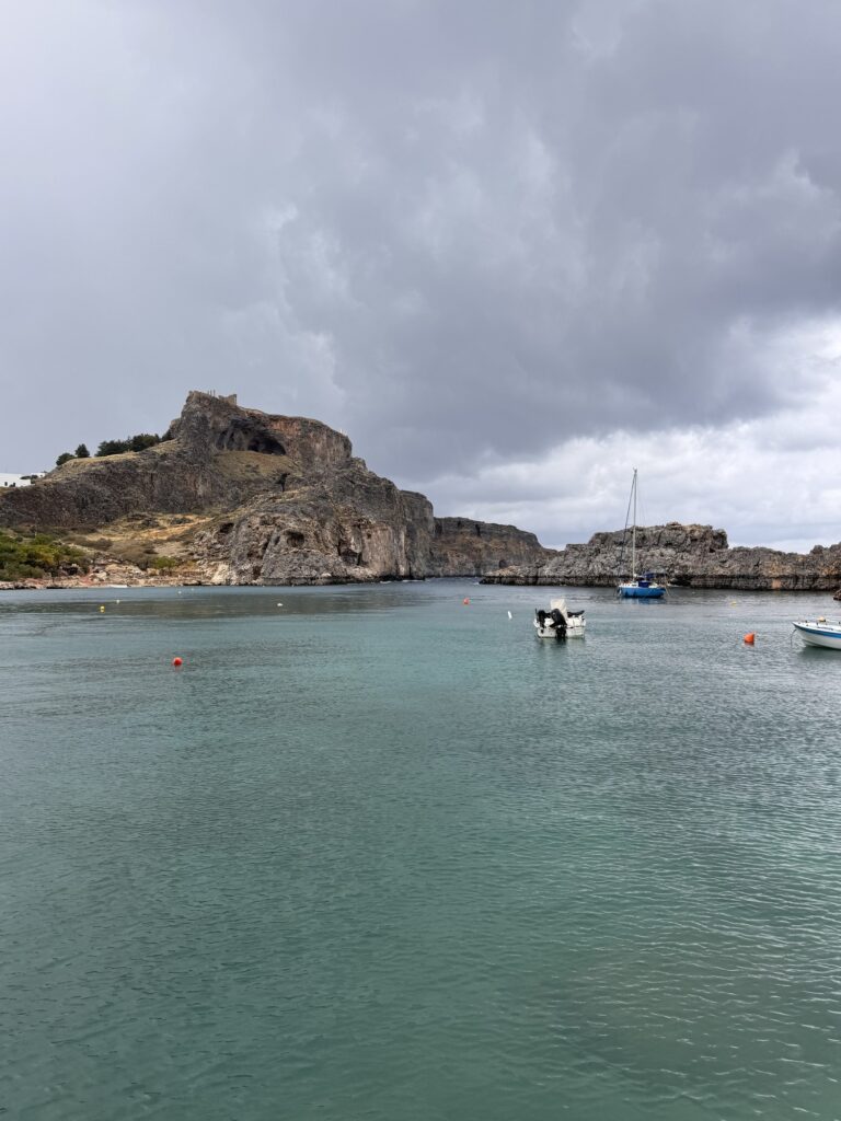 The acropolis of Lindos above the water of St. Paul’s Bay