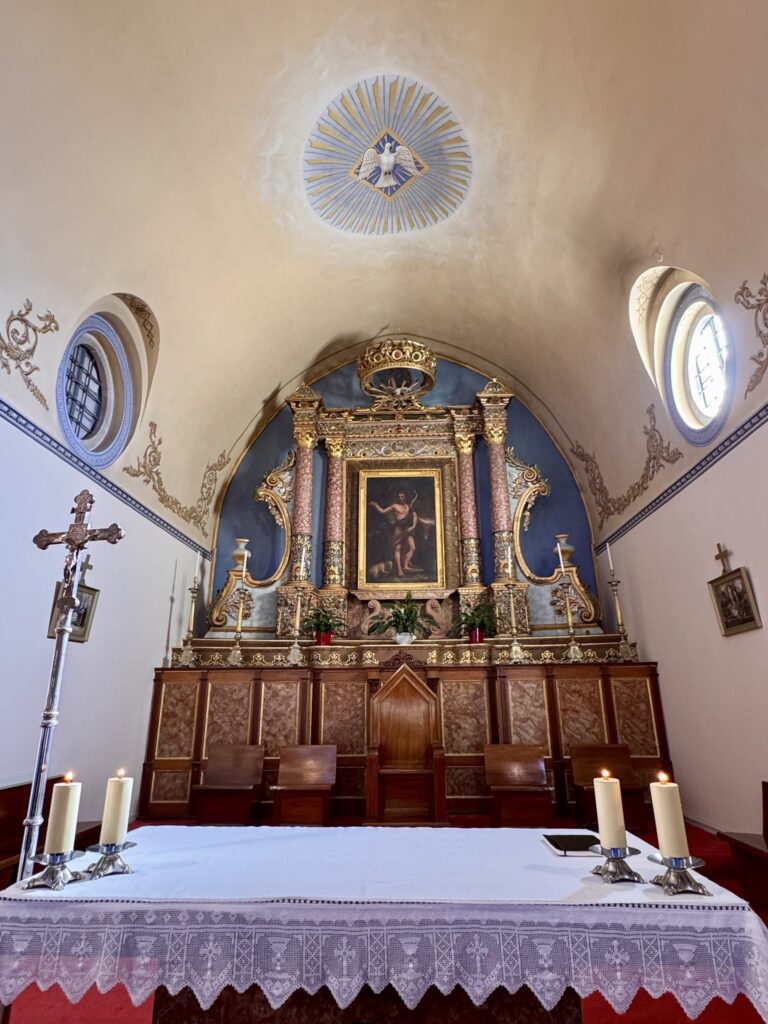 The altar and gilded reredos of the Catholic Cathedral of St. John the Baptist, Fira