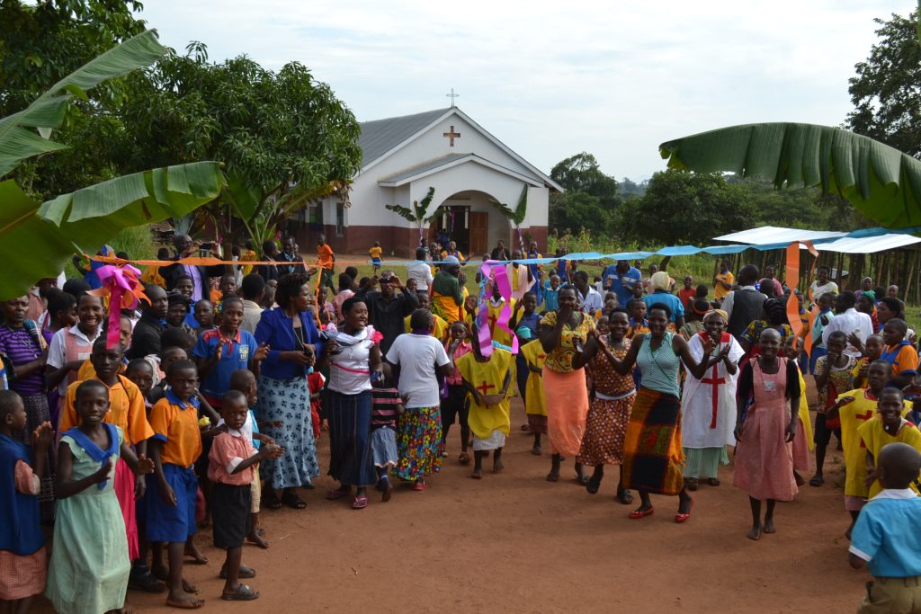 colorful crowds gather outside church