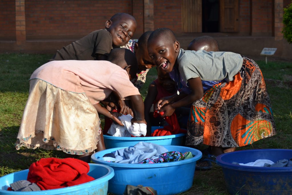 children was clothes in blue buckets