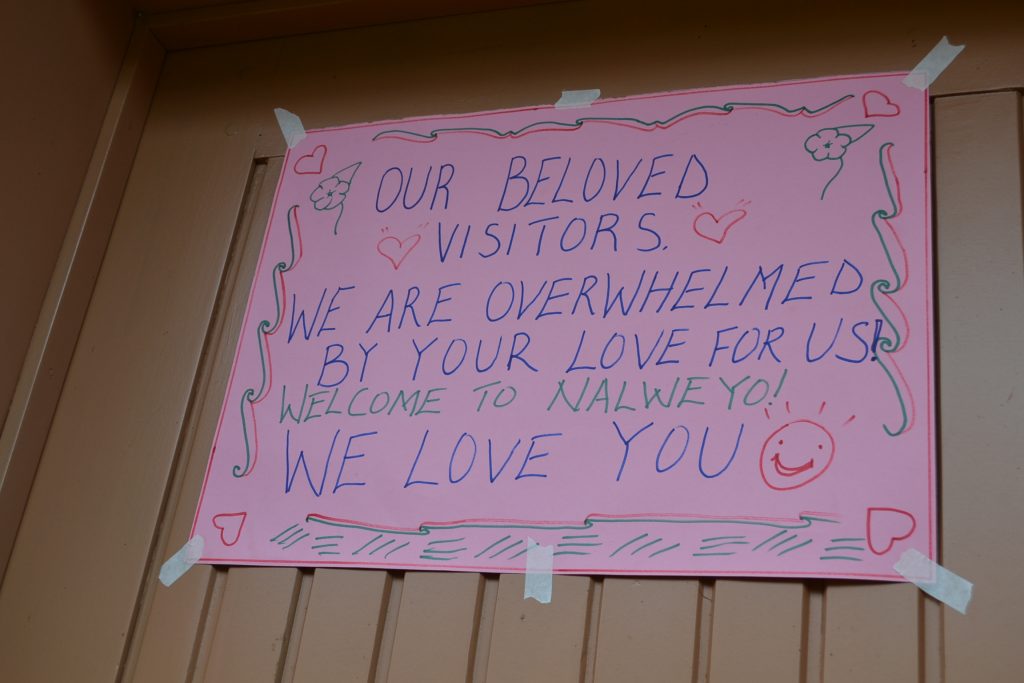 welcome poster taped on wall in staff house