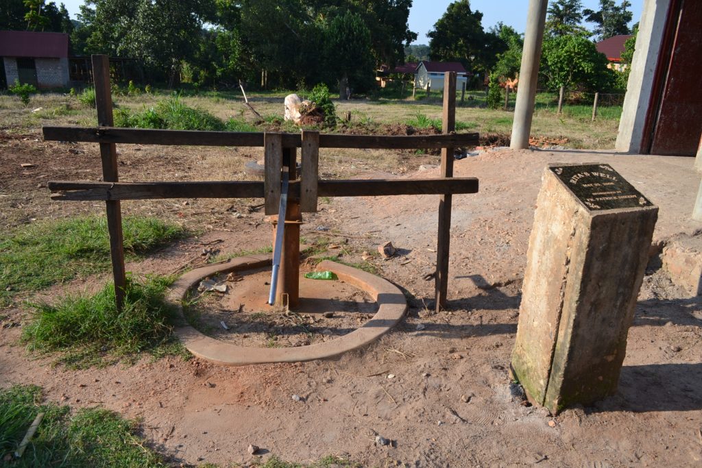 deep water well with dedication plaque