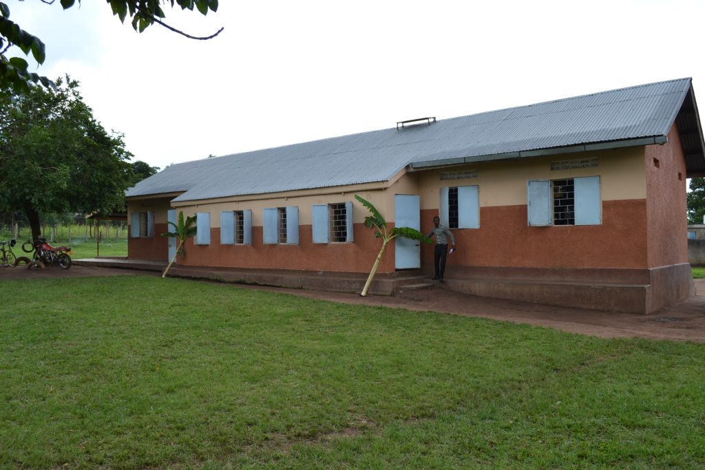 two-tone building with window shutters open