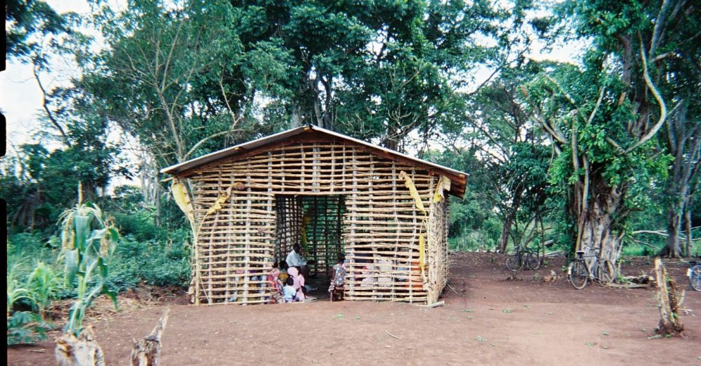 stick church with people inside