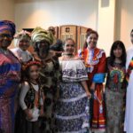 Representatives from two African countries, Poland, Colombia, Mexico and the Philippines stand with Deacon German Romero, before the entrance procession for Mass photo