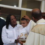 Priest conducting a baptism