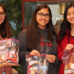 group of three young adult females photo