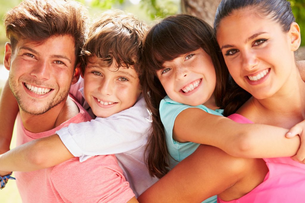 http://Parents%20Giving%20Children%20Piggyback%20Ride
