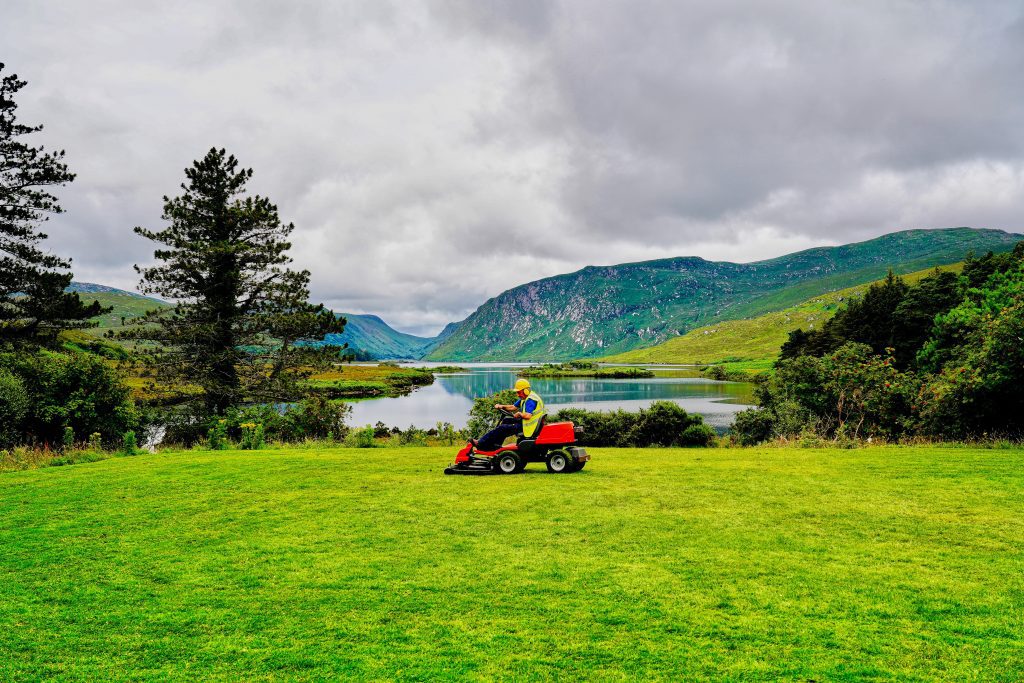 http://Man%20mowing%20lawn%20in%20front%20of%20lake