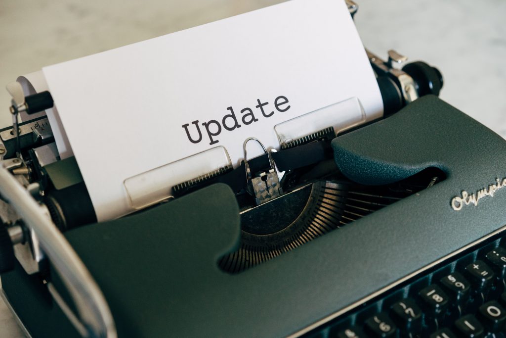 http://Typewriter%20with%20Update%20coming%20out%20of%20it.