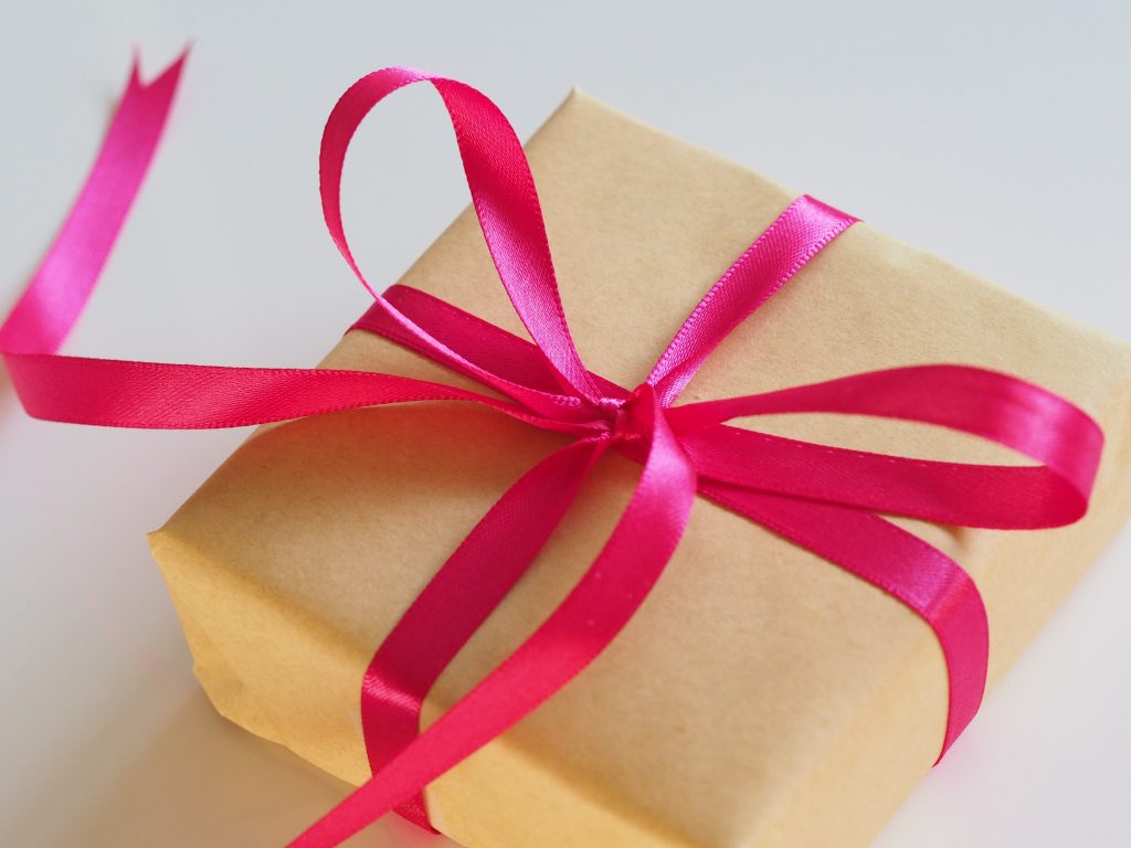http://Present%20wrapped%20with%20paper%20and%20pink%20bow