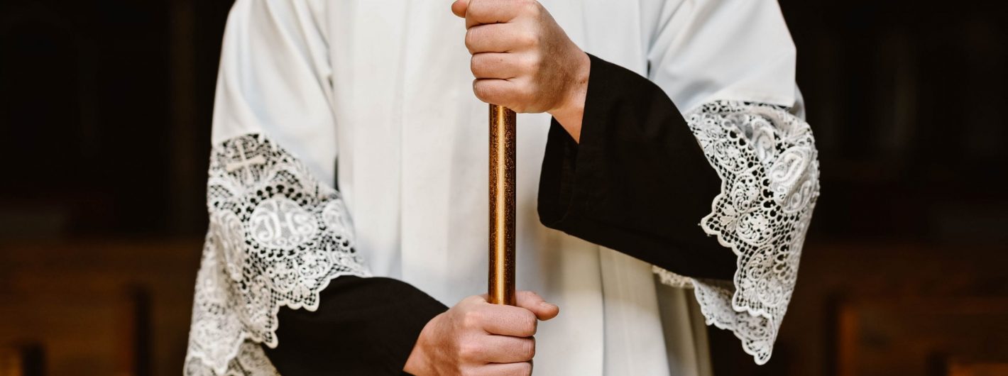 Altar Server holding Cross