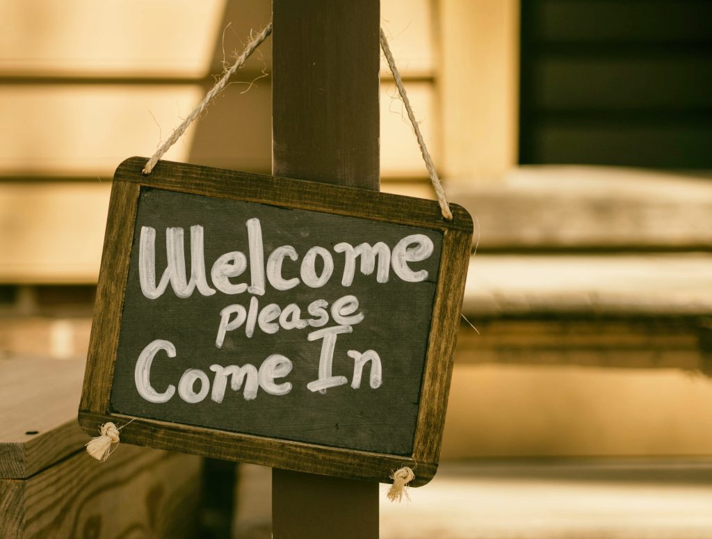 Welcome Please Come In Sign on Post