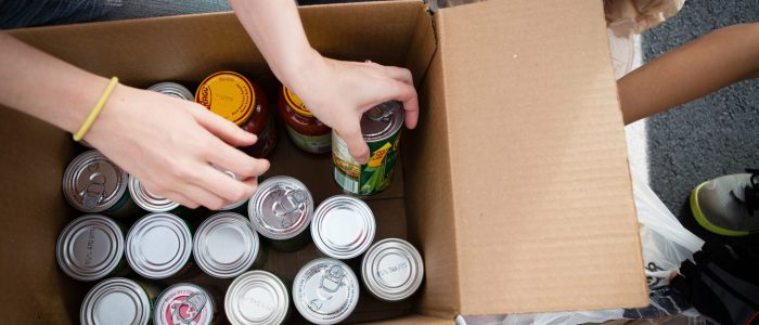 Volunteers Boxing Cans at Food Drive