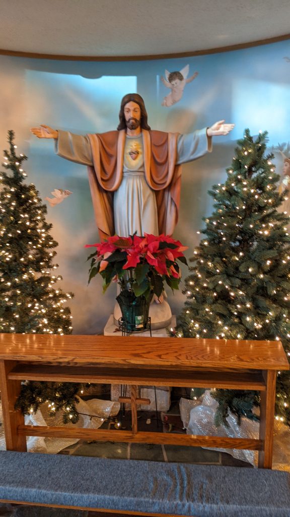 Sacred Heart of Jesus Statue at Christmas