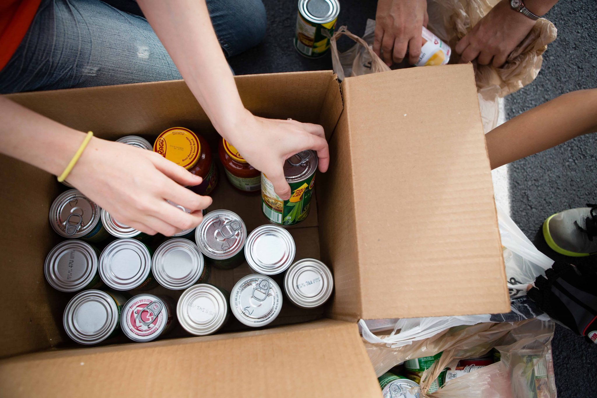 Volunteers Boxing Cans at Food Drive