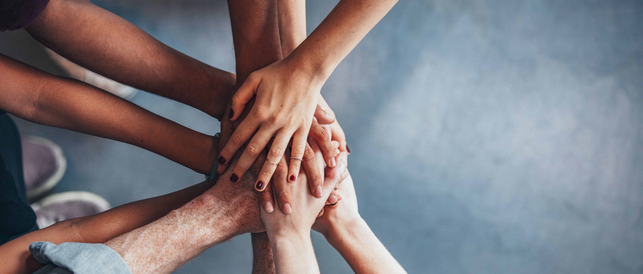 Stack of hands showing unity