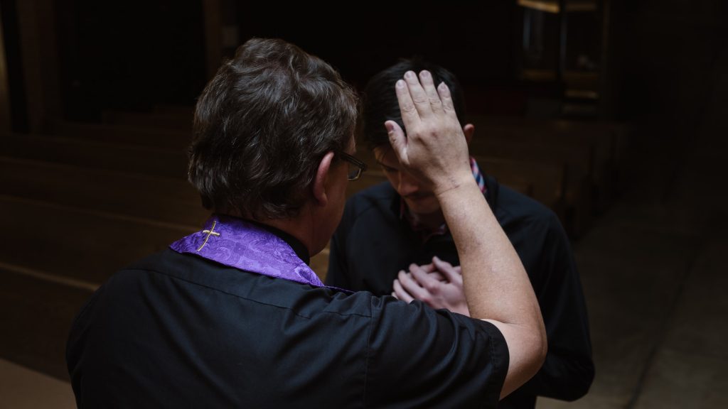Priest Absolving Man
