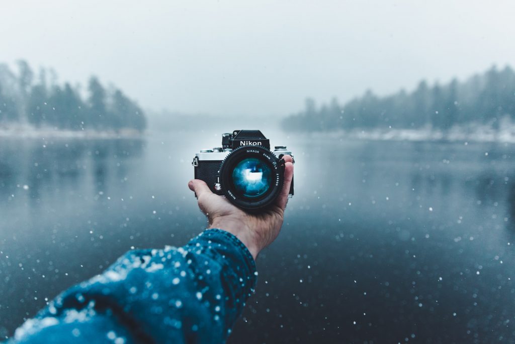 Person taking a photo of a camera