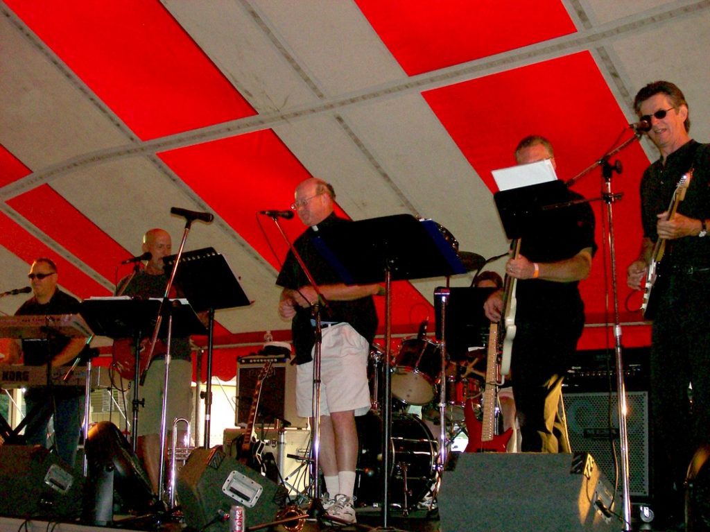 Band playing under big ten with Fr Brendan