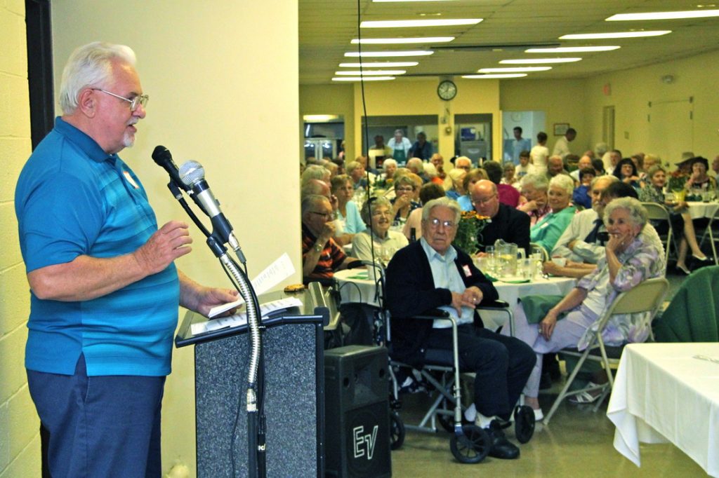 Man Speaking to returning school students