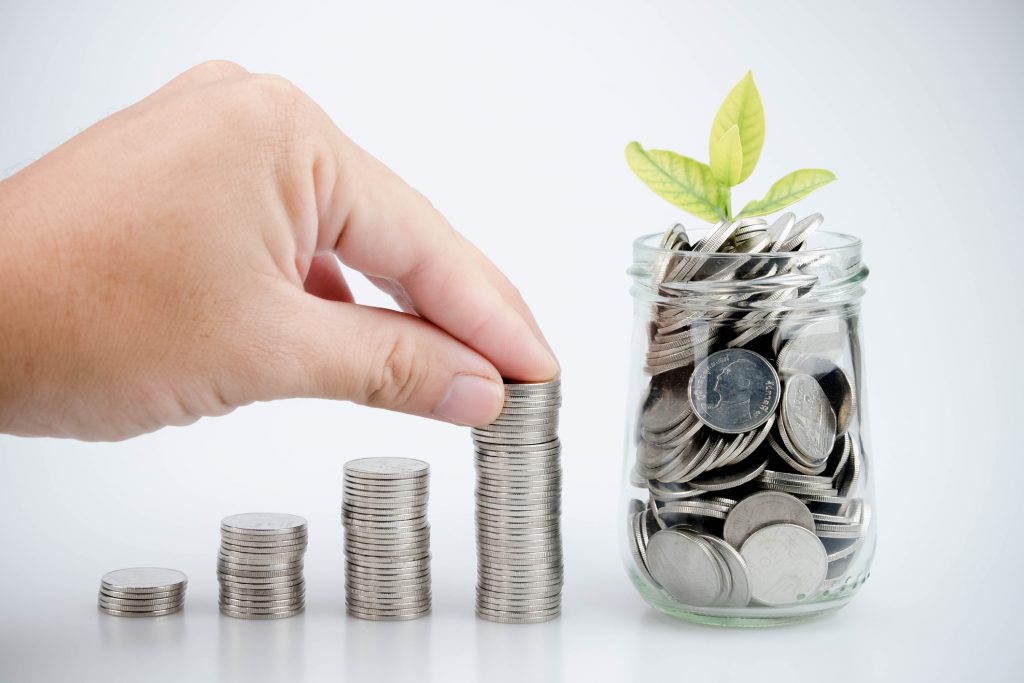 business finance. save money for investment concept money in the glass