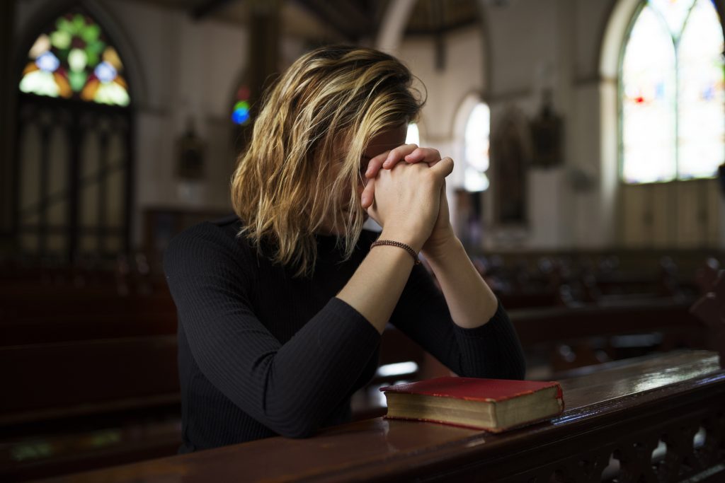 Woman Sitting In Church